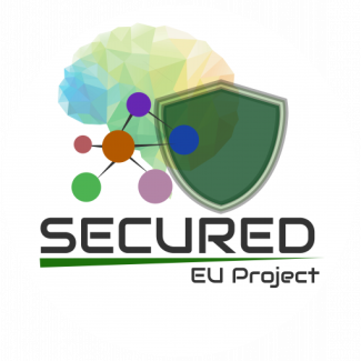 Logo del progetto dell'Unione Europea "SECURED". L'immagine mostra un cervello stilizzato a poligoni colorati a sinistra, una rete di nodi collegati al centro e uno scudo verde traslucido a destra che li protegge. Sotto gli elementi grafici, il nome del progetto "SECURED" è scritto in caratteri scuri sopra una linea verde, con il testo "EU Project" più piccolo e leggero sotto e a destra. Lo sfondo è bianco.